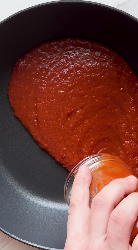 sauce prepped for Mantu topping with split yellow peas and seasonings